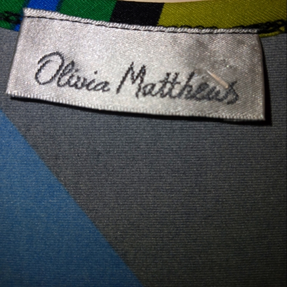 Olivia Matthews 2X black dress with blue, green, yellow and white detail lines